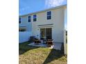 Cozy backyard featuring a patio with stylish seating, offering a relaxing outdoor space perfect for enjoying the fresh air at 20338 Lou Angela Ln, Lutz, FL 33558