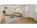 Inviting living room with sleek floors, shutters, and neutral color scheme at 3728 Linkwood St, New Port Richey, FL 34652