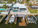 Waterfront property with pool, boat dock, and lift providing access to open waters at 4924 Dory Dr, New Port Richey, FL 34652