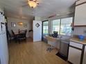 Functional kitchen with breakfast nook and adjacent dining area with space for entertaining at 5211 Wisteria Cir, New Port Richey, FL 34653