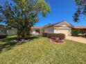 Charming single-story home with manicured lawn and a two-car garage at 7215 121St Ter, Largo, FL 33773