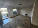 Cozy living room featuring carpet flooring, neutral walls, and natural light from exterior window at 10803 Hachita Dr, Port Richey, FL 34668