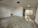 Open living room featuring neutral walls, carpet flooring, and sliding glass doors to back patio at 10803 Hachita Dr, Port Richey, FL 34668