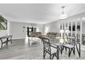 Spacious living room with updated floors, lots of light, and modern decor at 3590 Magnolia Ridge Cir # 1103-C, Palm Harbor, FL 34684