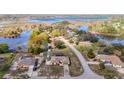 An aerial of a lake community featuring single Gathering homes at 6822 Eastbrook Dr, Spring Hill, FL 34606