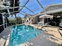 Screened-in pool and patio area perfect for outdoor relaxation and entertaining at 7748 Leighton Cir, New Port Richey, FL 34654