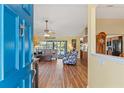 Bright foyer leading into the living room with an open concept design at 1281 Bolander Ave, Spring Hill, FL 34609