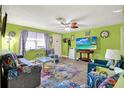 Living room with colorful decor, tile floors, and plenty of space for relaxation at 13906 Barnard Ave, Hudson, FL 34667