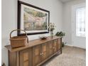 Welcoming entryway featuring stylish console table and artwork, setting a tone of refined taste at 1436 Gopher Loop, Tarpon Springs, FL 34689