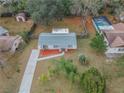 An aerial view of a well maintained home with a pool and fenced backyard at 5249 Courtland Rd, Spring Hill, FL 34608