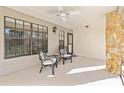 Relaxing covered front porch with seating, perfect for enjoying the outdoors at 6652 Brambleleaf Dr, Spring Hill, FL 34606