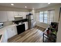 Cozy kitchen offering modern appliances and charming window views at 9485 Hamlin Blvd # 8, Seminole, FL 33776