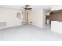 Open-concept living space with view to the kitchen; ideal for entertaining and modern living at 11001 Peppertree Ln, Port Richey, FL 34668
