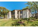 Exterior shot of condo building shows unit number 1737 and second story balconies at 1737 Pine Ridge W Way # B-1, Palm Harbor, FL 34684