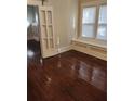 Inviting living space featuring gleaming hardwood floors and a window seat, perfect for relaxation at 315 Highland St, Brooksville, FL 34601