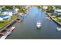 Waterfront community featuring canals and waterway access with a boat on the water at 4964 Cedarbrook Ln, Hernando Beach, FL 34607