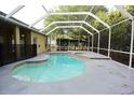 Screened-in pool and spa are the perfect backyard oasis for relaxation and entertainment at 19109 Beckett Dr, Odessa, FL 33556