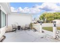 Outdoor patio featuring comfortable seating and decorative accents; perfect for relaxing and enjoying the outdoors at 2620 Baltic Pl, Holiday, FL 34691