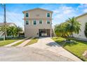 Charming elevated home with a spacious driveway, tropical landscaping, and a convenient under-house entrance at 4058 Centavo Ct, Hernando Beach, FL 34607