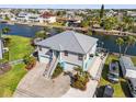 Gorgeous waterfront property with lush landscaping, a metal roof, and ample parking, with canal access at 4207 Carlos Ct, Hernando Beach, FL 34607