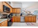 Well maintained kitchen with tile floors, granite counters and modern appliances at 4516 Seagull Dr # 509, New Port Richey, FL 34652