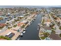Aerial view showing waterfront homes lining a canal, each with private docks and boat access at 5000 Southshore Dr, New Port Richey, FL 34652