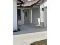Beautiful white front door with decorative glass on a well manicured lawn at 7336 Ivory Ter, New Port Richey, FL 34655