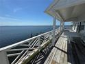 Expansive porch overlooking the serene blue waters of the bay at 121 Augusta Ave, Palm Harbor, FL 34683