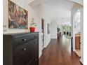 Welcoming entryway with hardwood floors, high ceilings, and stylish decor at 1250 Halapa Way, Trinity, FL 34655