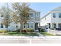 Charming two-story home with landscaped front yard, sidewalk, and welcoming entrance at 3465 Bumelia Ln, New Port Richey, FL 34655