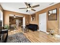 Cozy living room showcasing wood floors, ceiling fan, and an open layout for easy entertaining at 4725 3Rd S Ave, St Petersburg, FL 33711