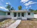 Close-up shot of the single-story home's front entrance with a walkway at 10921 Stamford Dr, Port Richey, FL 34668
