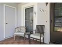 Close-up of cozy front porch with seating and address display at 12505 Dearborn Dr # C, Hudson, FL 34667
