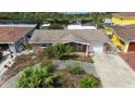 Charming single-story brick home featuring a well-maintained front yard and attached one car garage at 12801 5Th Isle, Hudson, FL 34667