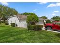 The house has a well-maintained lawn, adding to the curb appeal of the property at 2309 Terrace View Ln, Spring Hill, FL 34606