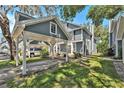 A view of charming townhomes with covered parking and landscaped grounds at 290 Winchester Way, Palm Harbor, FL 34684