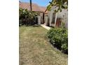Manicured front yard with mature landscaping and decorative walkway at 3054 Pelican Pl, Clearwater, FL 33762