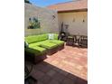 Secluded patio with cozy lounge area, tile flooring and art accents at 3054 Pelican Pl, Clearwater, FL 33762