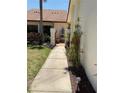 Landscaped walkway to front door has decorative plants and pavers at 3054 Pelican Pl, Clearwater, FL 33762