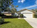 Relaxing screened porch with comfortable seating, ceiling fans, and views of the lush backyard at 3142 Crenshaw Ct, New Port Richey, FL 34655