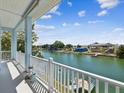 Enjoy waterfront views from this balcony overlooking a canal and the neighborhood at 3215 Hibiscus Dr, Hernando Beach, FL 34607