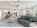 Bright and airy living space seamlessly connects to the modern kitchen and dining area, ideal for relaxation and gatherings at 4237 Marine Pkwy, New Port Richey, FL 34652