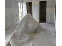 An unfinished bedroom with natural light and two closets at 4557 Garnet Dr # 102, New Port Richey, FL 34652