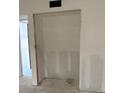 Spacious walk-in closet ready to be finished for optimal storage in a home at 4557 Garnet Dr # 102, New Port Richey, FL 34652