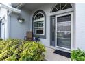 Inviting front porch with seating and decorative plants at 9348 Villa Entrada, New Port Richey, FL 34655