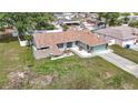 Charming single-story home featuring a well-manicured lawn and an attached two-car garage at 12087 Tallwood St, Spring Hill, FL 34608