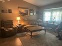 Cozy living room with comfortable seating, natural light, and neutral tones at 1332 Inca Ave, Spring Hill, FL 34608
