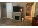 Features a built-in fireplace, entertainment center and neutral tones at 1332 Inca Ave, Spring Hill, FL 34608