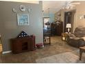 Inviting living room with tile floors, neutral tones, and vintage furnishings at 1332 Inca Ave, Spring Hill, FL 34608