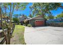 Charming two-story home featuring a well-maintained lawn, gray exterior paint, and a cozy, welcoming presence at 28330 Peterson Camp Rd, Brooksville, FL 34601